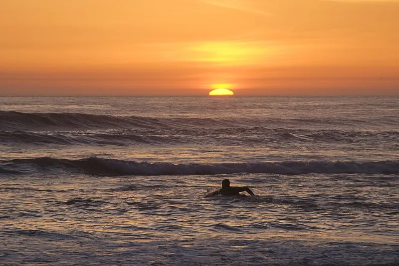 Cold Water, No Rubber: The Surfers Paddling Out Bare-Skinned All Winter Long